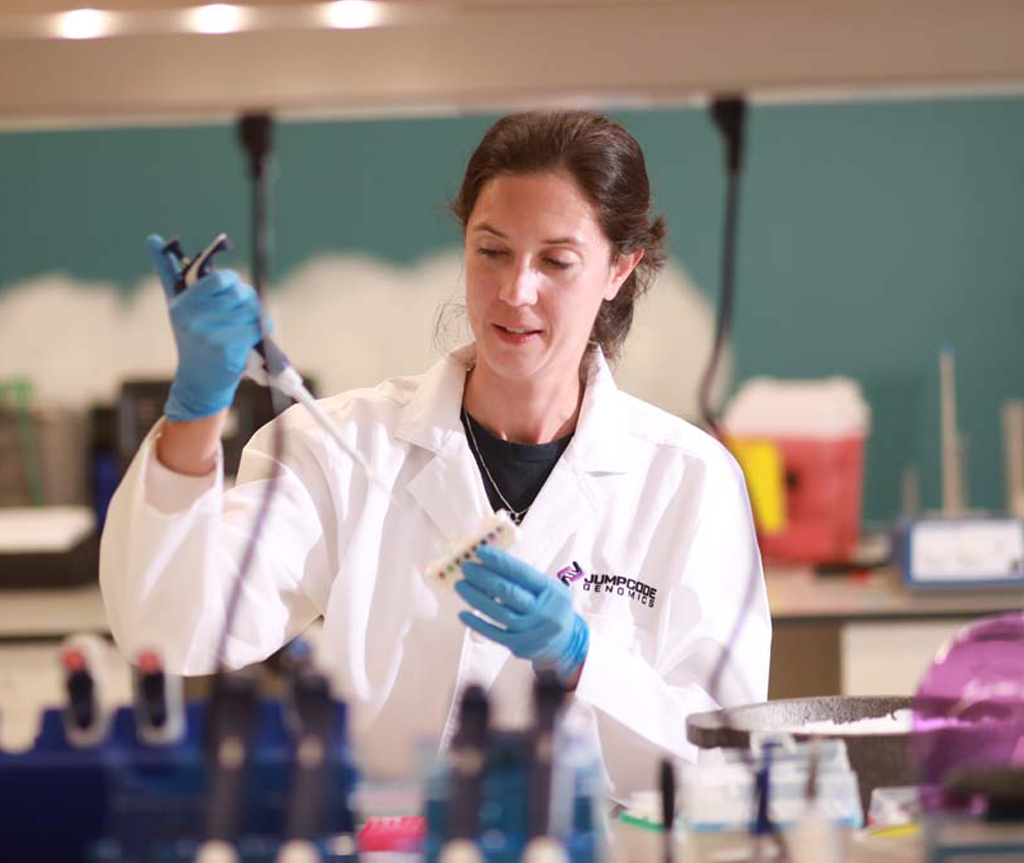 Jumpcode researcher in the lab pipetting